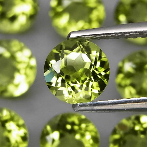 High grade 7.94ct untreated apple green Peridot set