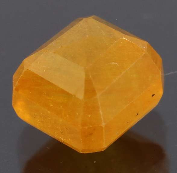 Vibrant 5.26ct emerald cut orange Sapphire