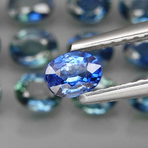 Heated only! 3.89ct blue green Sapphire set