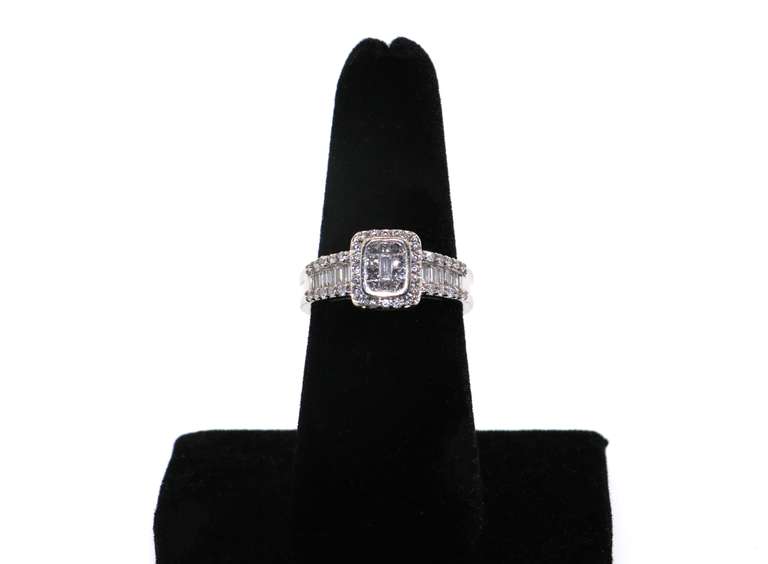 14kt White Gold Cluster Ring with round and baguette Diamonds