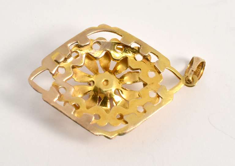 Garnet Pendant with Ornate Gold Work