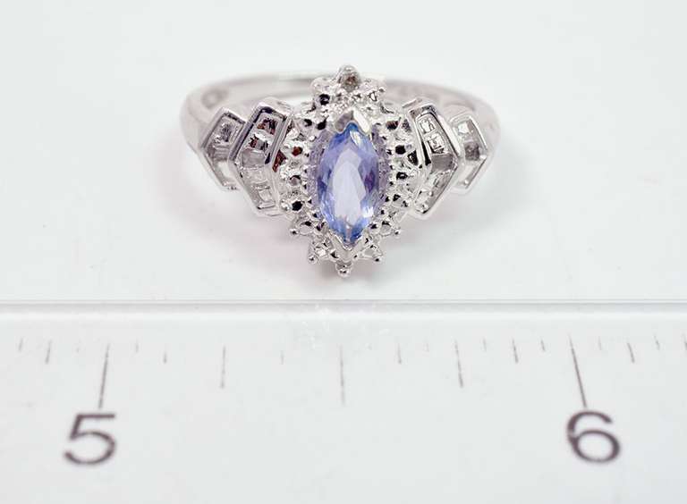Sparkling Purple Gemstone Ring in White gold with Diamonds