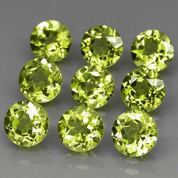 High grade 7.94ct untreated apple green Peridot set