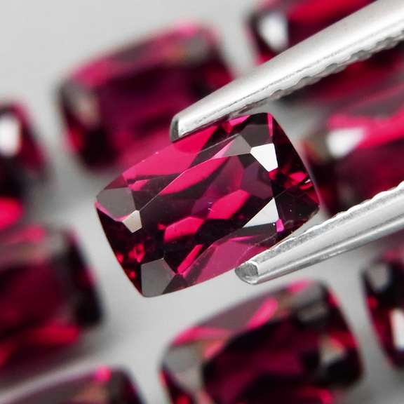 Amazing 8.87ct cushion cut violet Garnet set