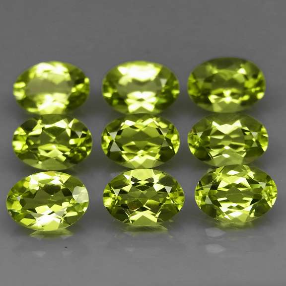 Dazzling 7.26ct untreated apple green Peridot set