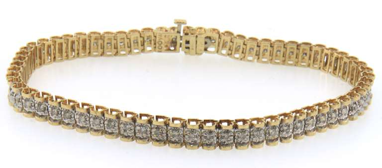 Eye- Catching 14k yellow & white gold diamond tennis bracelet