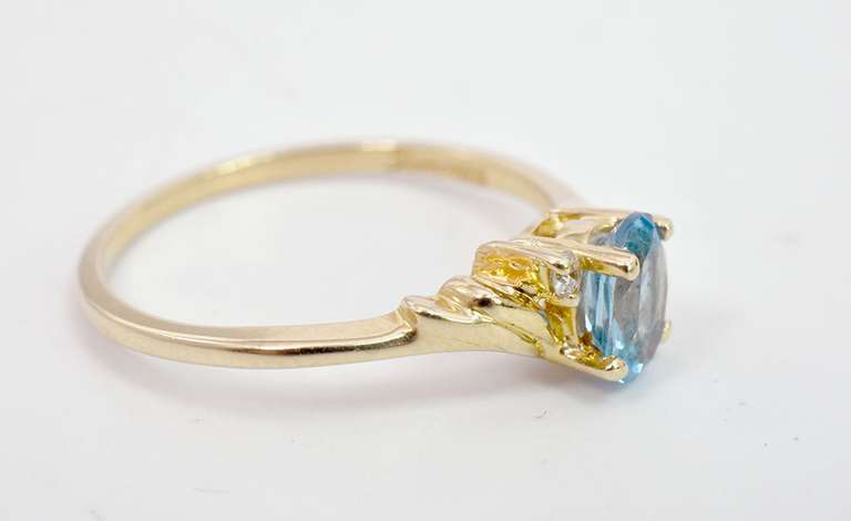 Darling Oval Cut Topaz Set in 14K Yellow Gold Ring with Diamond Accents