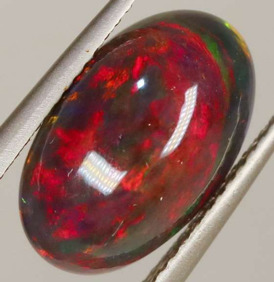 Glistening 3.11ct fiery flashing Welo Black Opal