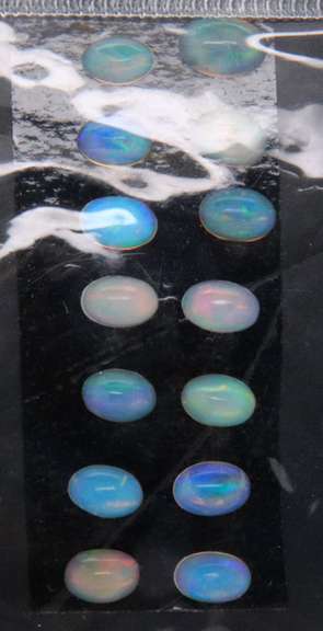 Excellent Group of 14 Oval Cut Opal Gemstones, 4.52cts