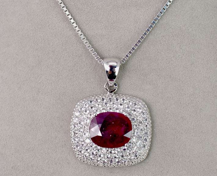 Ravishing 8.22CTS Ruby Set within A Sterling Silver Pendant with a 3.23CTW White Sapphire Gallery