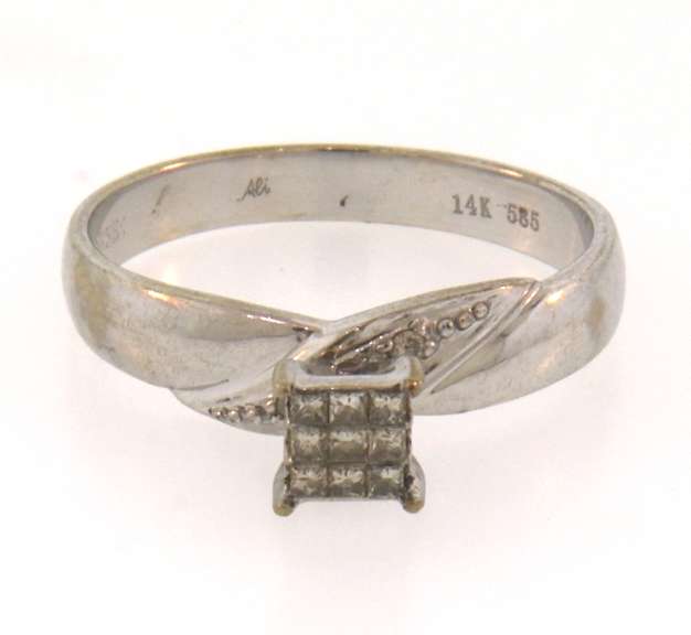 Pretty 14k white gold ring with princess cut diamonds
