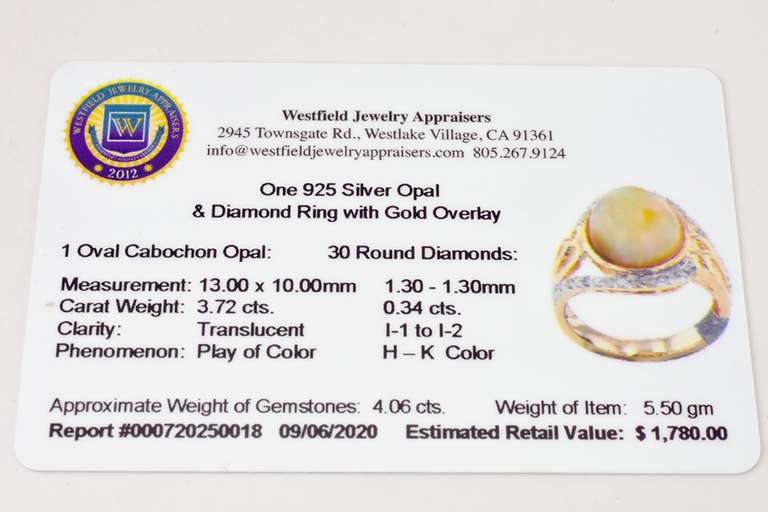 Opulent 3.72CTS Cabochon Opal Set in Open Shoulder Sterling Silver Ring with 0.34CTW Accenting Diamonds