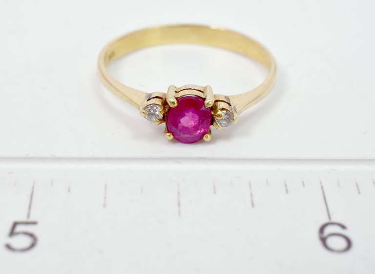 Lovely Oval Cut Ruby Set in 18K Yellow Gold Diamond Ring