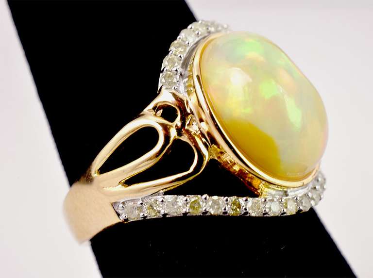 Opulent 3.72CTS Cabochon Opal Set in Open Shoulder Sterling Silver Ring with 0.34CTW Accenting Diamonds