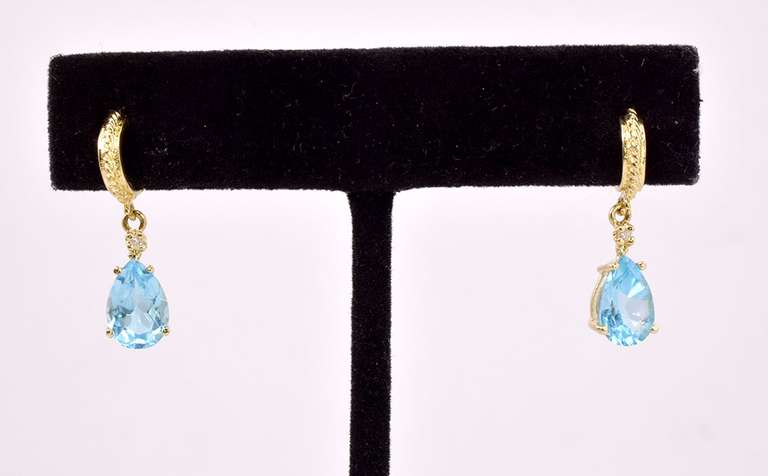 Gorgeous Pear Shaped Blue Topaz Stones Set in 14K Yellow Gold Earrings