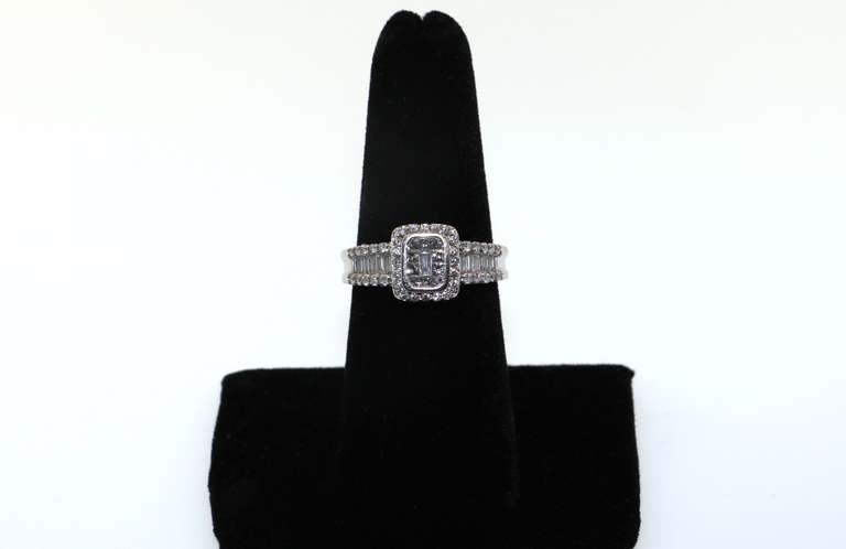 14kt White Gold Cluster Ring with round and baguette Diamonds