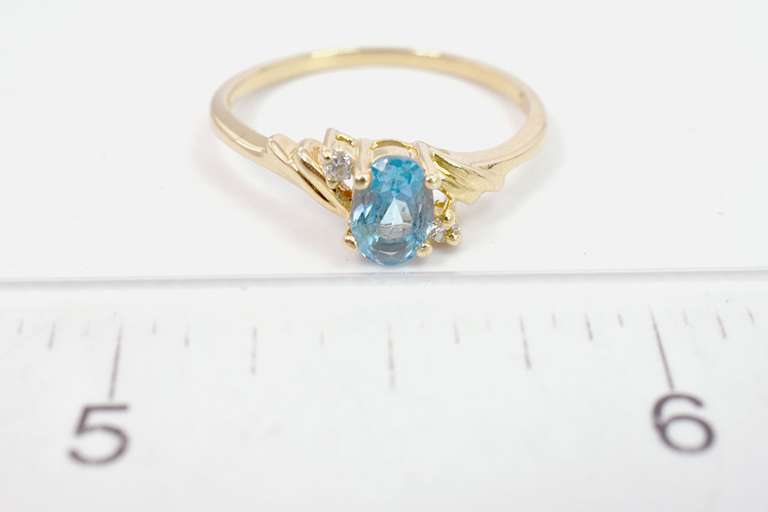 Darling Oval Cut Topaz Set in 14K Yellow Gold Ring with Diamond Accents