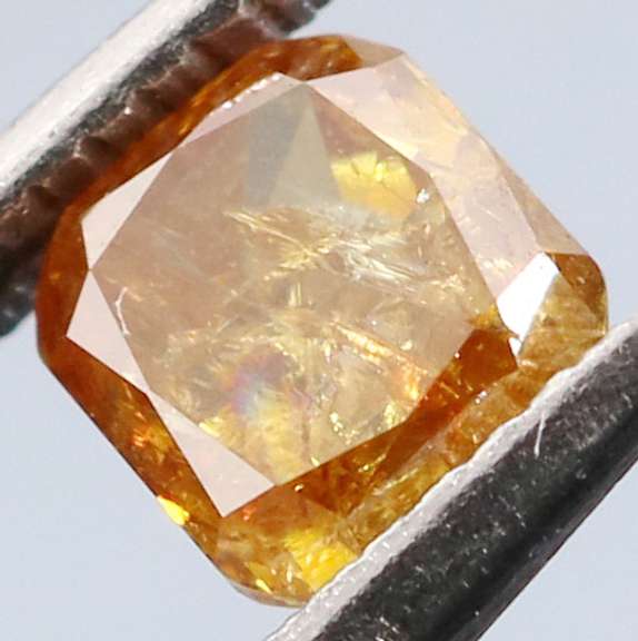 Stunning .27ct cushion cut red orange Diamond