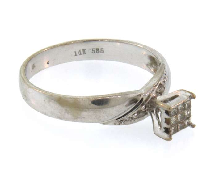 Pretty 14k white gold ring with princess cut diamonds
