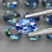 Heated only! 3.89ct blue green Sapphire set
