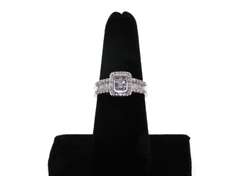 14kt White Gold Cluster Ring with round and baguette Diamonds