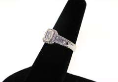 14kt White Gold Cluster Ring with round and baguette Diamonds