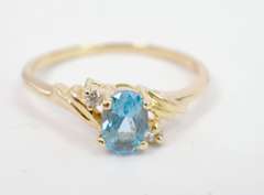 Darling Oval Cut Topaz Set in 14K Yellow Gold Ring with Diamond Accents