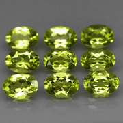 Dazzling 7.26ct untreated apple green Peridot set