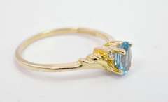 Darling Oval Cut Topaz Set in 14K Yellow Gold Ring with Diamond Accents