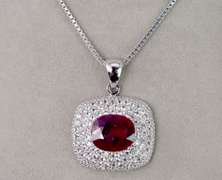 Ravishing 8.22CTS Ruby Set within A Sterling Silver Pendant with a 3.23CTW White Sapphire Gallery