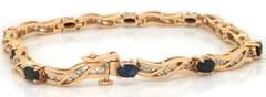 LADIES 14 KT YELLOW GOLD DIAMOND AND SAPPHIRE BRACELET.