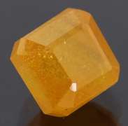 Vibrant 5.26ct emerald cut orange Sapphire