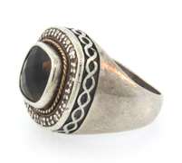 Sterling silver antique ring with brown precious stone