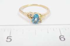 Darling Oval Cut Topaz Set in 14K Yellow Gold Ring with Diamond Accents