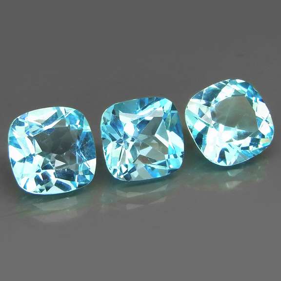Large 14.05ct vivid blue cushion cut Topaz set