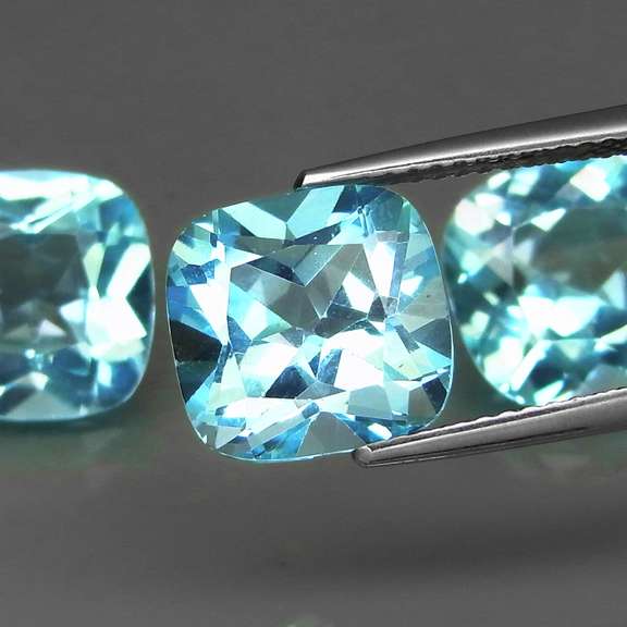 Large 14.05ct vivid blue cushion cut Topaz set