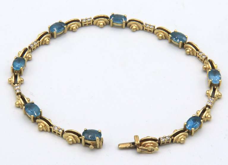 LADIES 14 KT YELLOW GOLD TOPAZ AND DIAMOND BRACELET