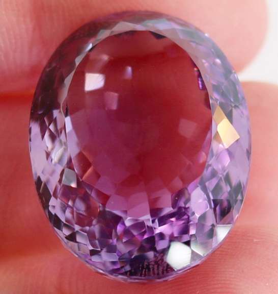 Substantial oval cut 51.91ct violet Amethyst