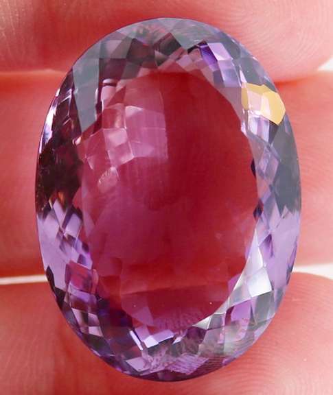Substantial oval cut 51.91ct violet Amethyst