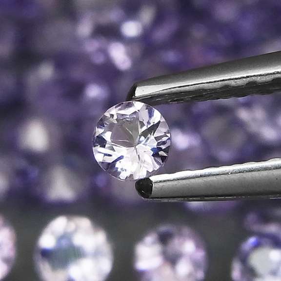 Heavy flashing 5.06ct diamond cut Tanzanite set