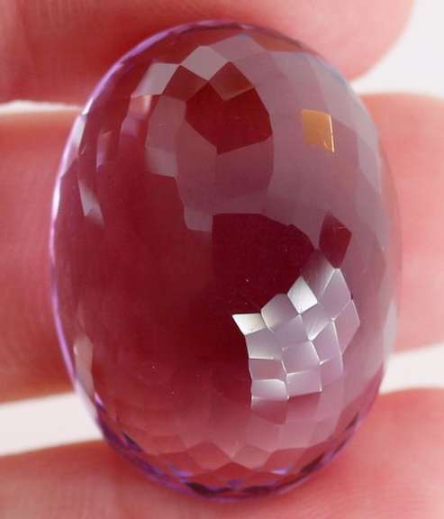 Substantial oval cut 51.91ct violet Amethyst