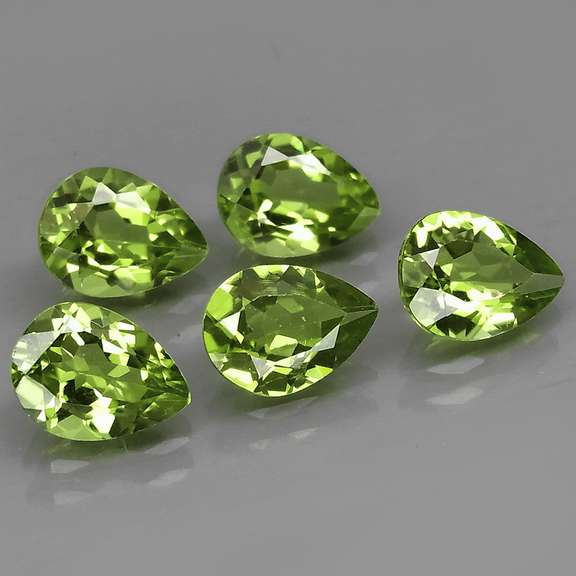 Dazzling 6.17ct untreated apple green Peridot set