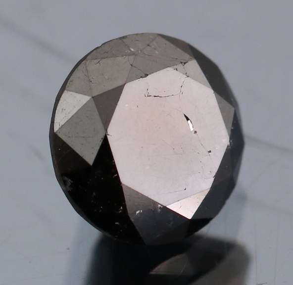 Elegant 1.37ct smooth cut Black Diamond solitaire