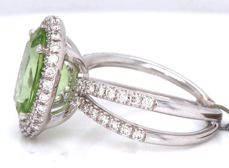 Dreamy 18kt Peridot Oval Cut and RBC Diamond Halo Double Shank Ring