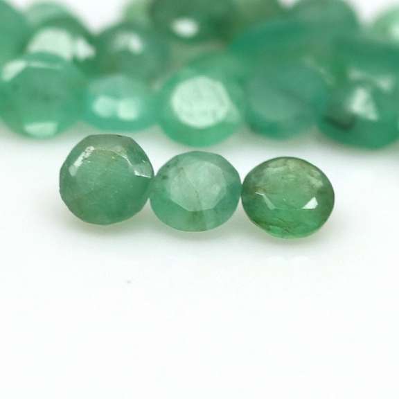 Rich emerald green 6.46ct 37pc emerald set