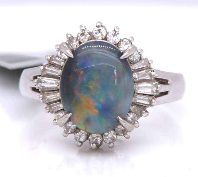 Handsome Oval Black Opal and Baguette Diamond Halo Ring