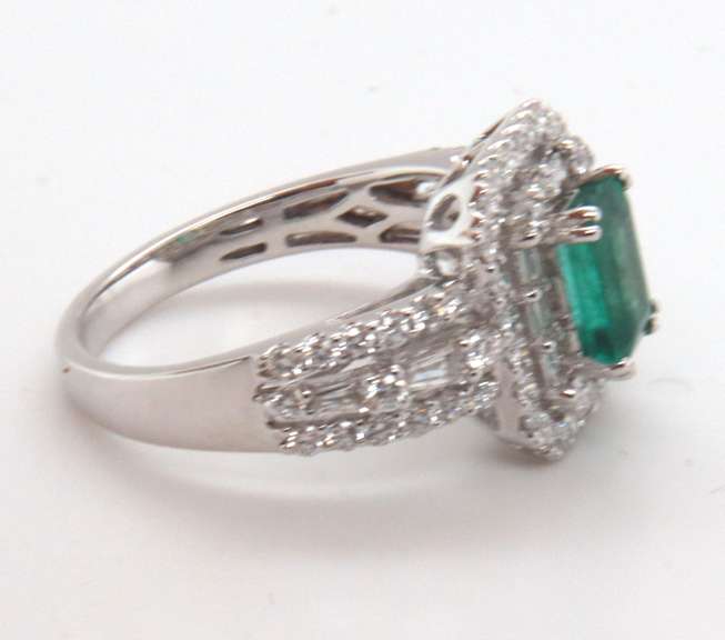 Beautifully Intricate Emeral Ring Engulfed in Diamonds with an 18k Stamped White Gold Band