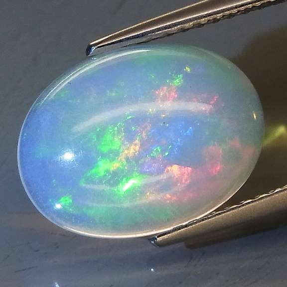 Vibrant 2.72ct rolling floral flashing Welo Opal