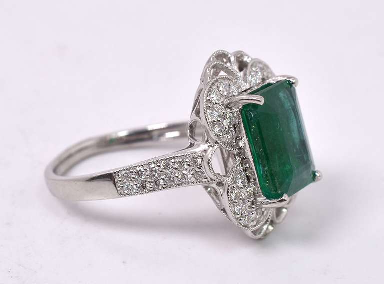 Radiant Lady's Platinum Ring with Emerald and Diamonds