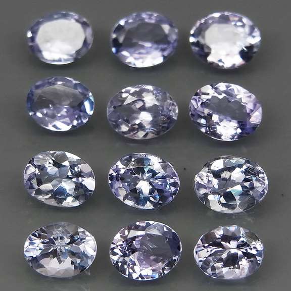 Heavy flashing 3.99ct oval cut Tanzanite set